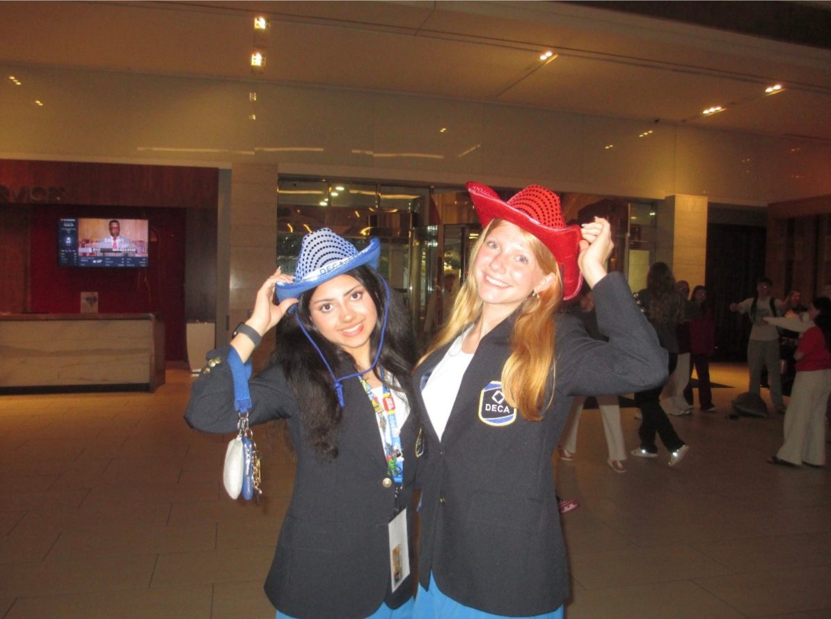 STEM Spark Initiative co-founders Tara and Kristen at a DECA conference.